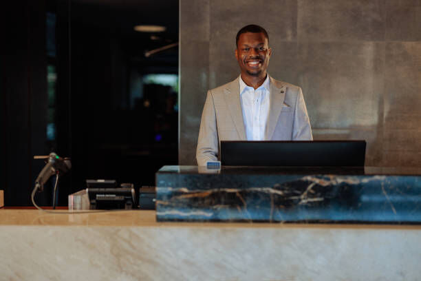 Hospitality professional working at a hotel front desk